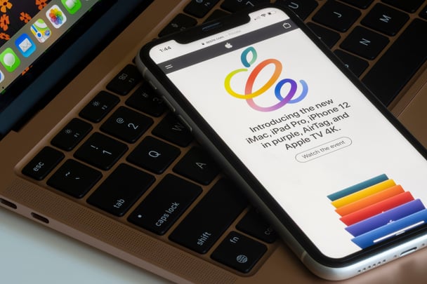 Digital word of mouth marketing with Apple product launch announcement on a smartphone.