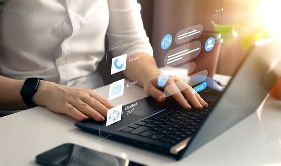 Person using CRM system to manage customer support channels, showcasing CRM benefits for engagement.