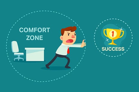 Cartoon man in a bubble that says "Comfort Zone", struggling to reach a bubble that says "Success".