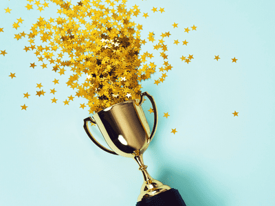 Award filled with gold stars on a blue background.